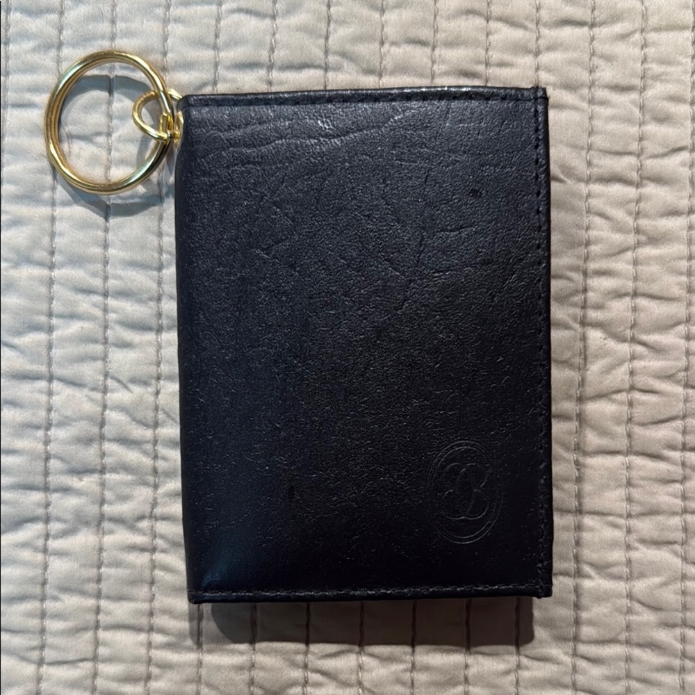 Black Buxton Leather keychain card holder.